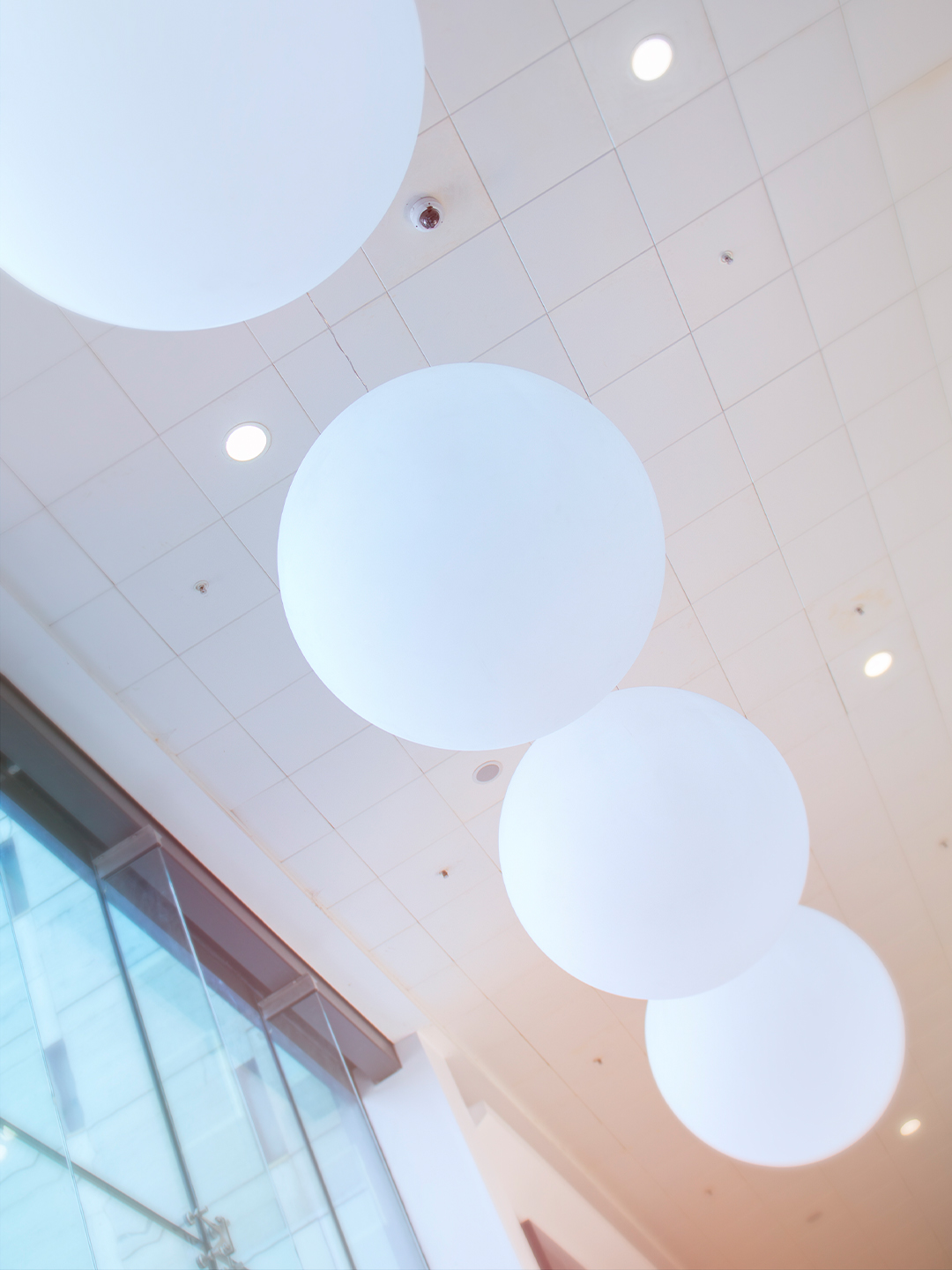 A row of orb light fixtures in Basildon's Eastgate Shopping Centre.